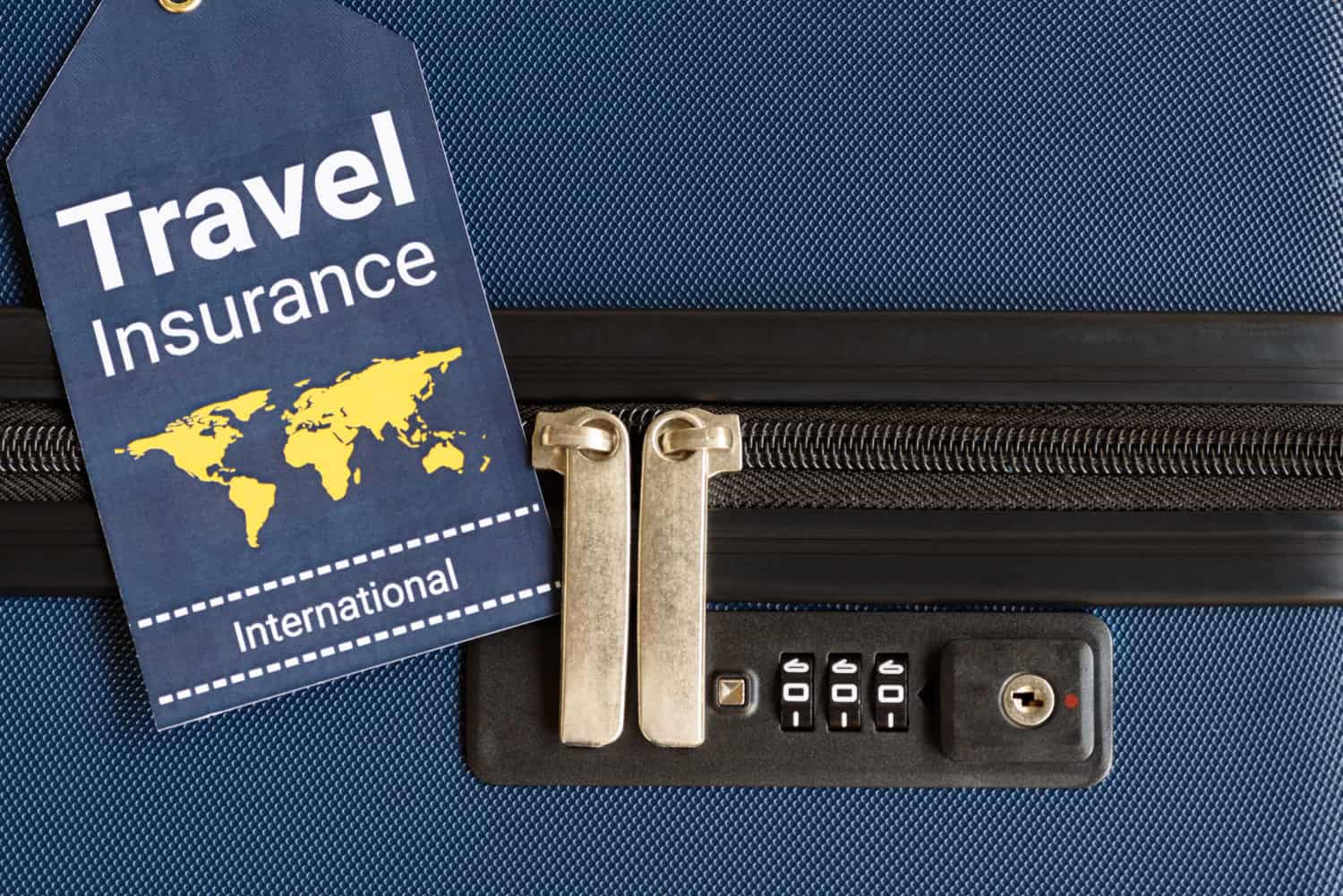 Reiseversicherungs Label an Koffer